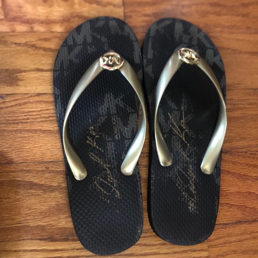 Michael Kors Black and gold rubber flip flops